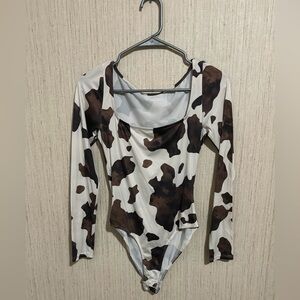 Cow print long sleeve square neck bodysuit .